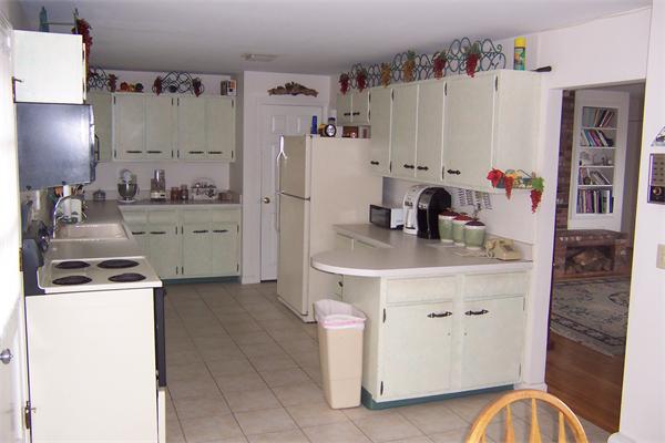 47 Bay Shore Road Barnstable, MA 02601 - Photo 11 of 22 a kitchen with stainless steel appliances a stove a refrigerator and a refrigerator