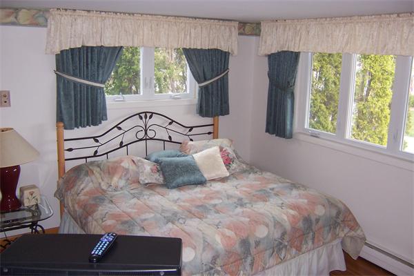 47 Bay Shore Road Barnstable, MA 02601 - Photo 13 of 22 a bedroom with a bed and window