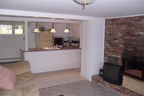47 Bay Shore Road Barnstable, MA 02601 - Photo 15 of 22 a living room with a couch and a table