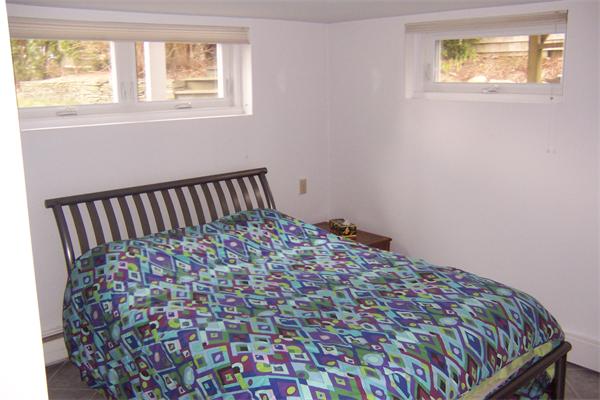 47 Bay Shore Road Barnstable, MA 02601 - Photo 16 of 22 a bedroom with a bed and a window