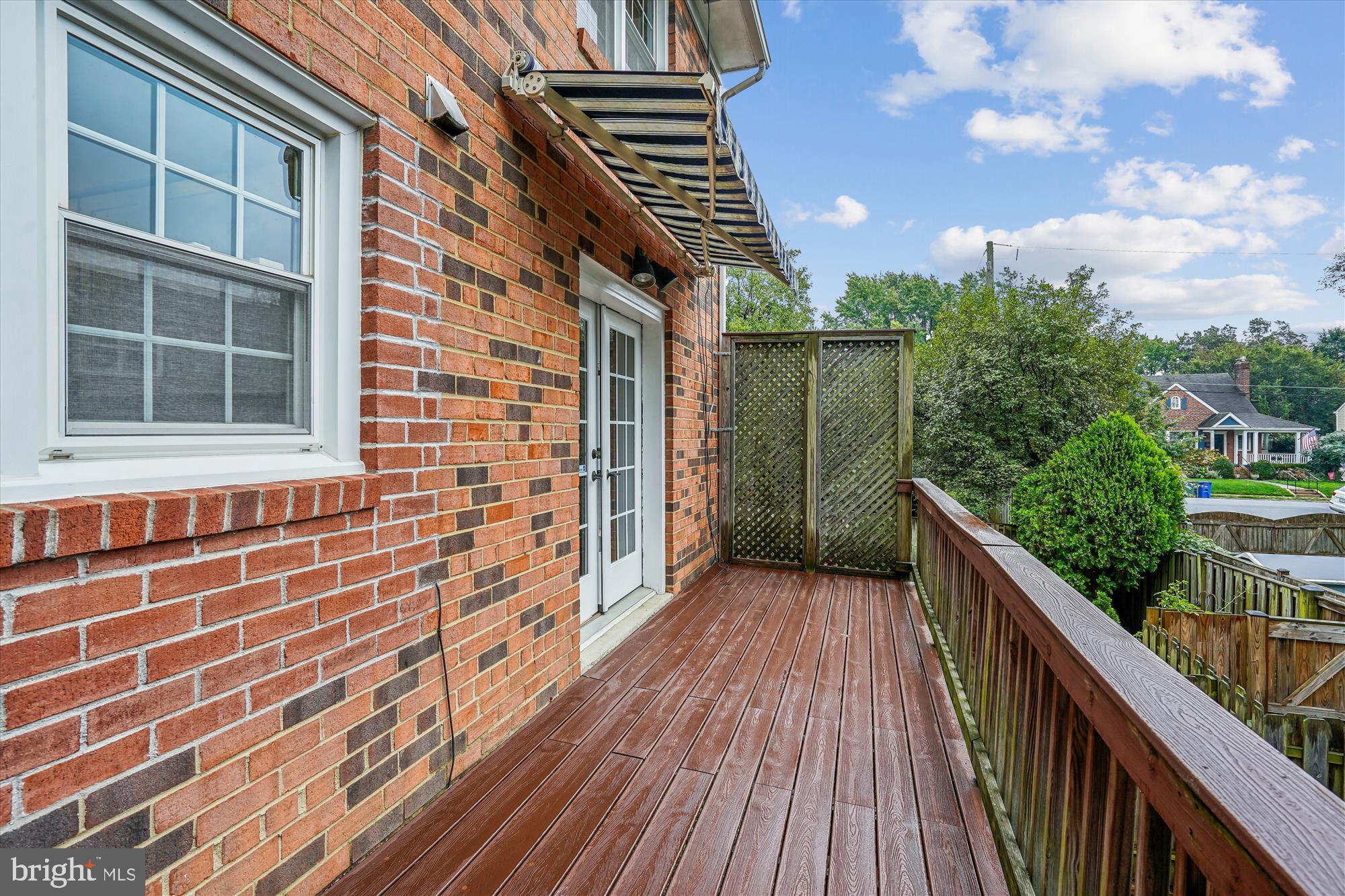24 South Abingdon Street Arlington, VA 22204 - Photo 11 of 66 a view of a balcony with wooden floor and fence