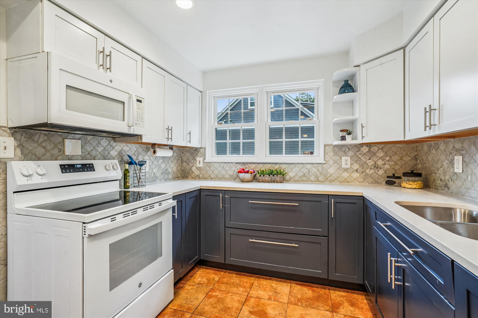 24 South Abingdon Street Arlington, VA 22204 - Photo 14 of 66 a kitchen with a sink stove and cabinets