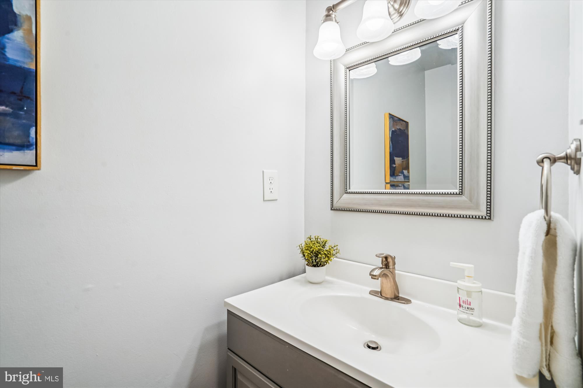 24 South Abingdon Street Arlington, VA 22204 - Photo 17 of 66 a bathroom with a sink and a mirror