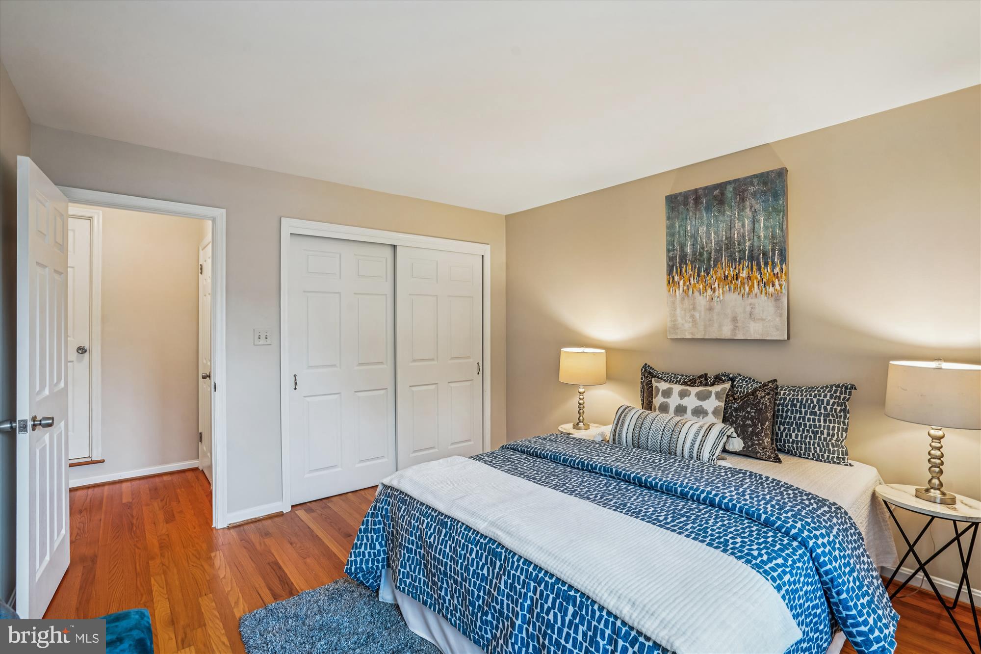 24 South Abingdon Street Arlington, VA 22204 - Photo 28 of 66 a bedroom with a bed and a lamp with wooden floor