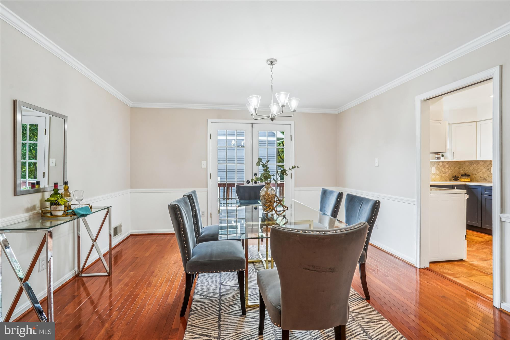 24 South Abingdon Street Arlington, VA 22204 - Photo 8 of 66 a dining room with furniture a chandelier and wooden floor