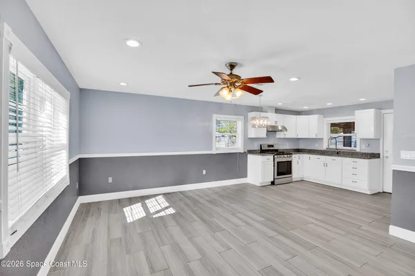 a view of kitchen with cabinets and wooden floor