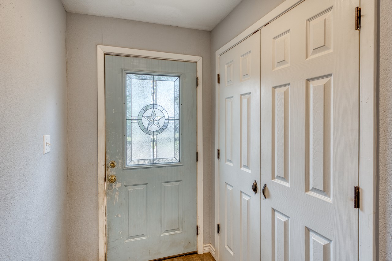 609 Dickson Street Lexington, TX 78947 - Photo 18 of 36 a view of a front door of a house