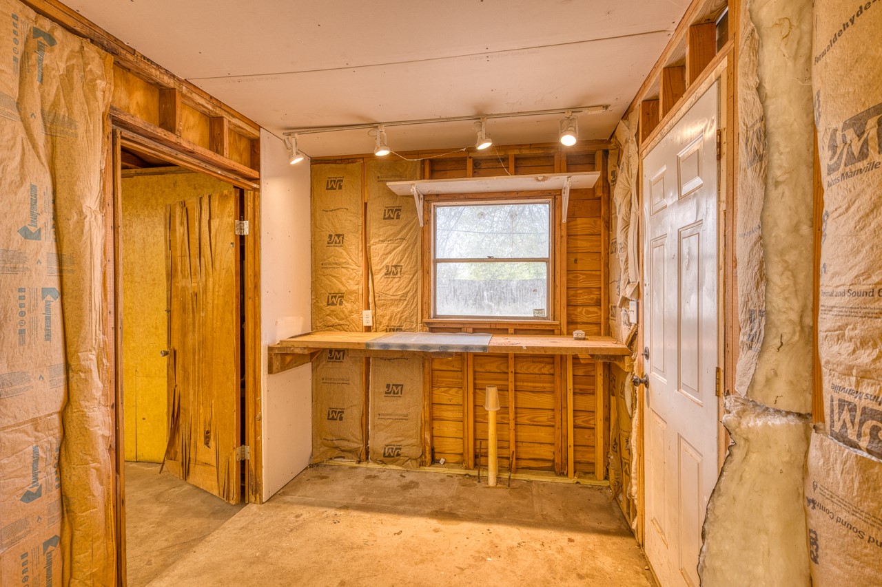 609 Dickson Street Lexington, TX 78947 - Photo 33 of 36 a bathroom with a granite countertop sink and shower