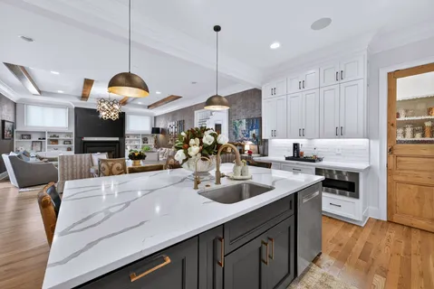 a dining room with furniture wooden floor a flat screen tv and a fireplace