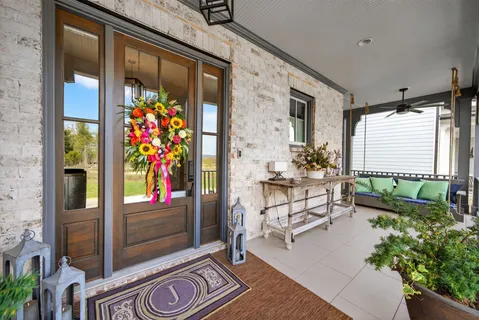 a view of a porch with furniture