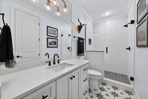 an aerial view of residential house with an outdoor space and seating