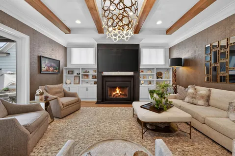a living room with fireplace furniture and a flat screen tv