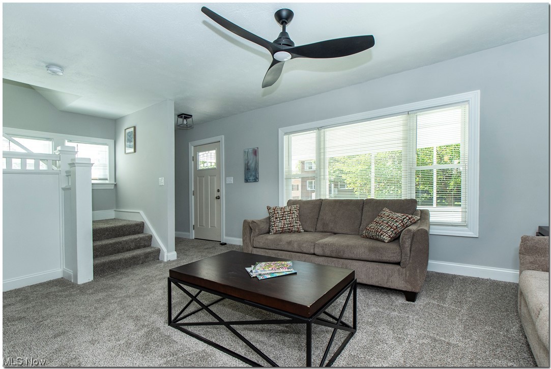 815 Thayer Street Akron, OH 44310 - Photo 6 of 32 Carpeted living room with ceiling fan