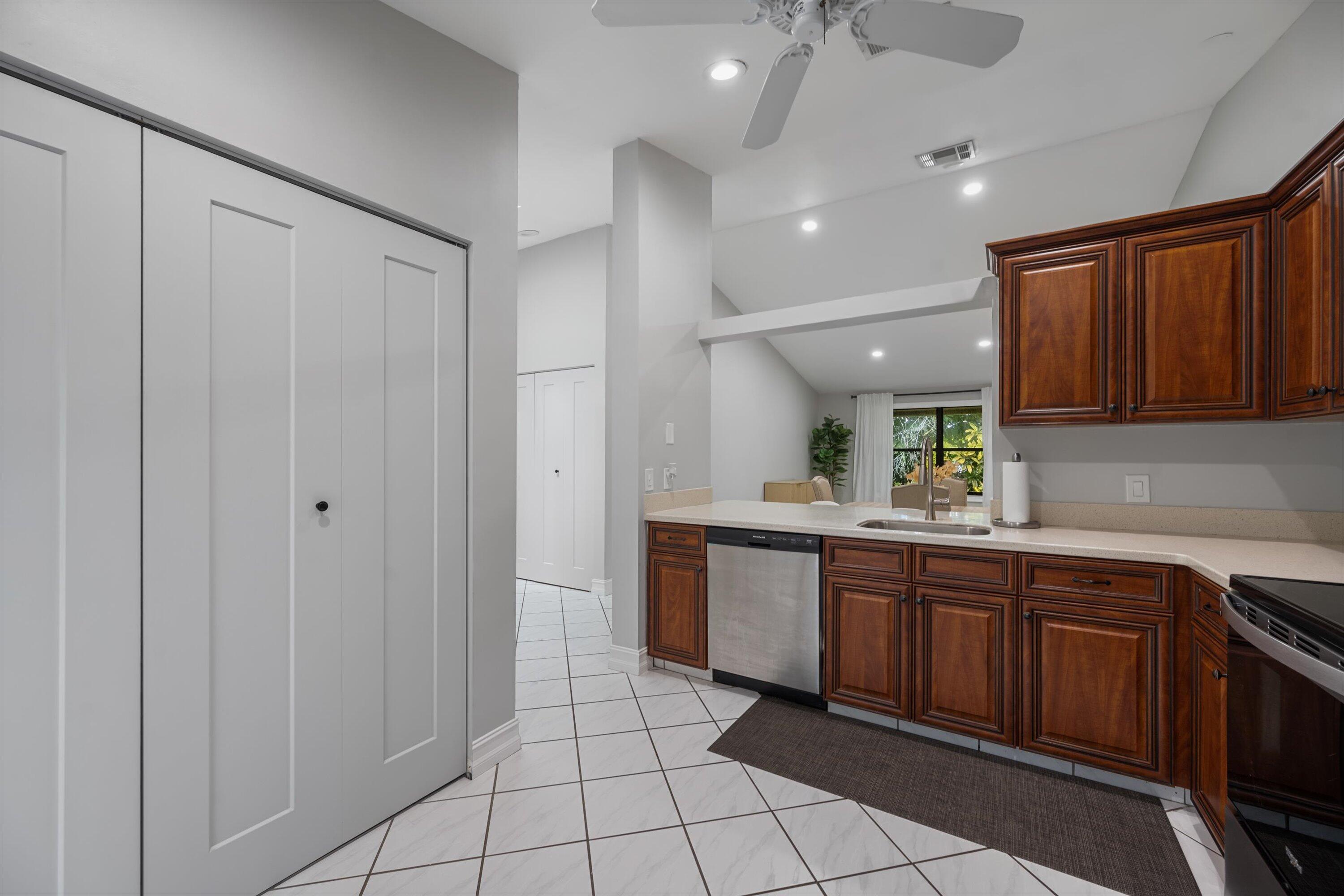 12970 Dartford Trail, Unit 4 Wellington, FL 33414 - Photo 13 of 23 a spacious bathroom with a sink a mirror and a bathtub