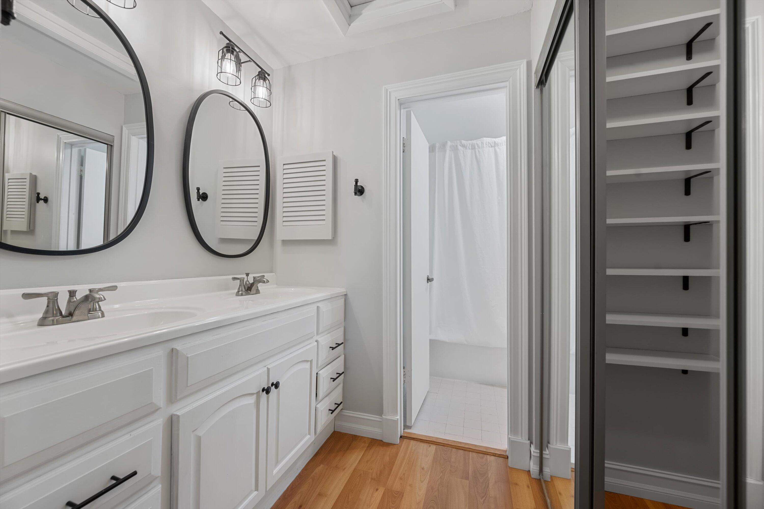 12970 Dartford Trail, Unit 4 Wellington, FL 33414 - Photo 16 of 23 a bathroom with a double vanity sink and a mirror