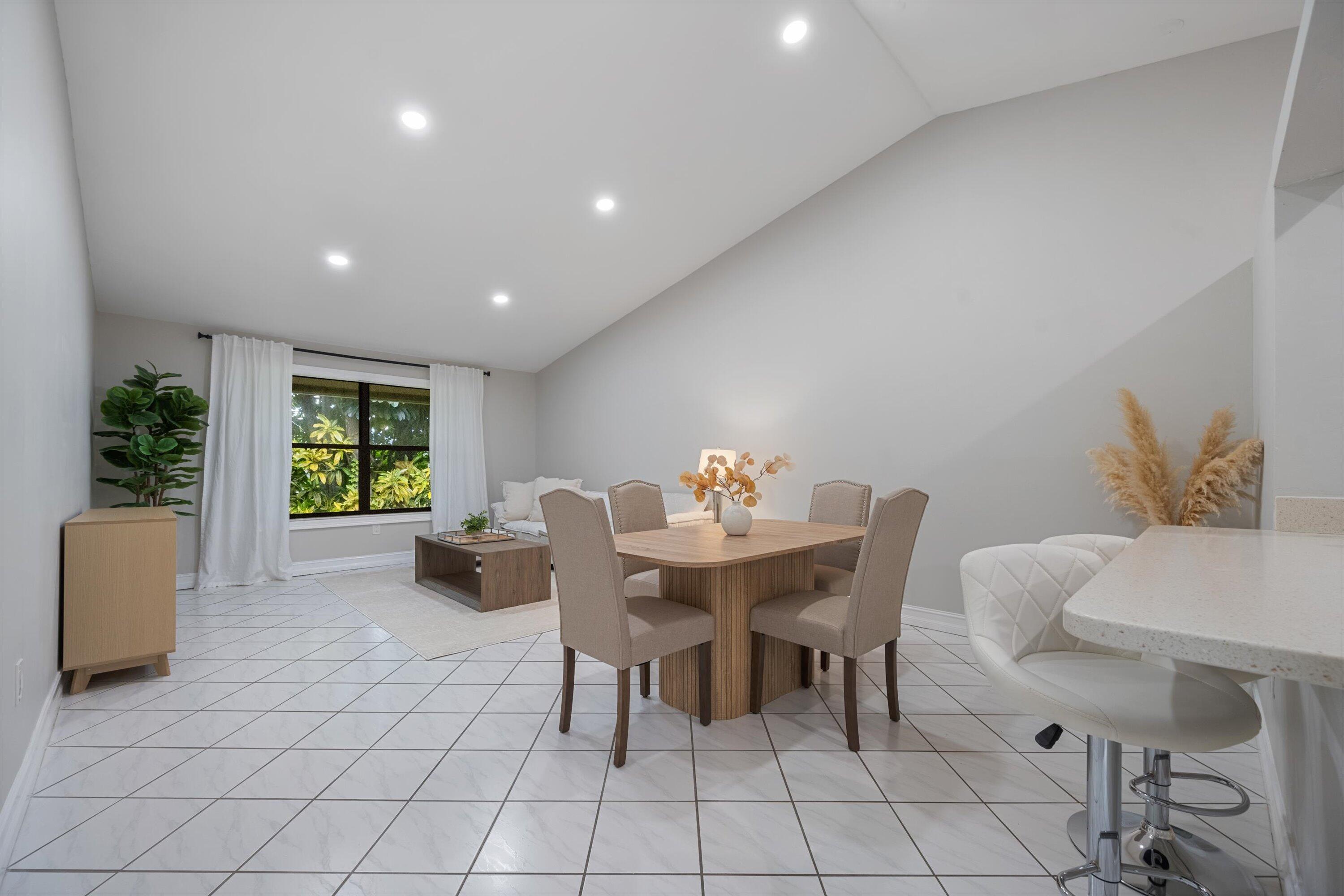 12970 Dartford Trail, Unit 4 Wellington, FL 33414 - Photo 6 of 23 a view of a dining room with furniture window and outside view