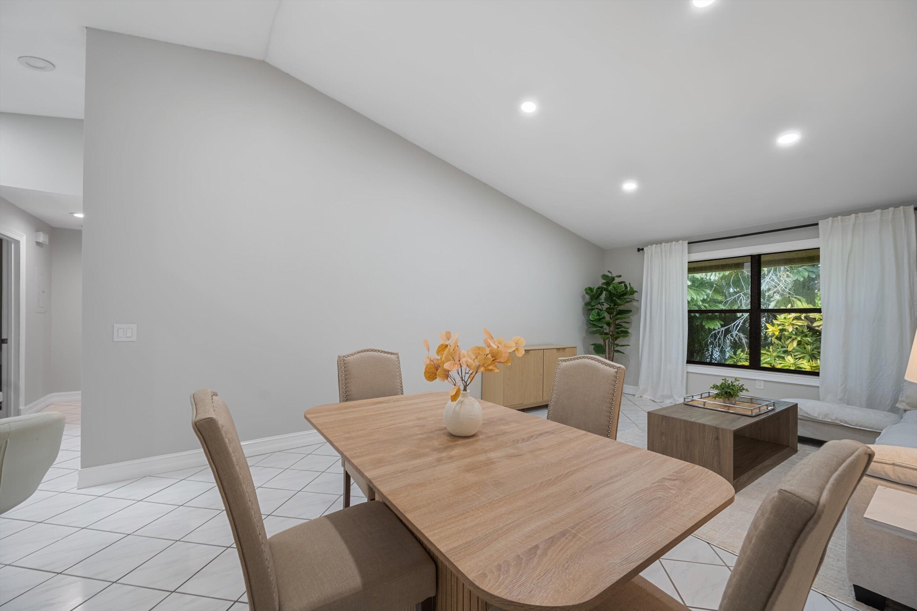 12970 Dartford Trail, Unit 4 Wellington, FL 33414 - Photo 7 of 23 a view of a dining room with furniture and window