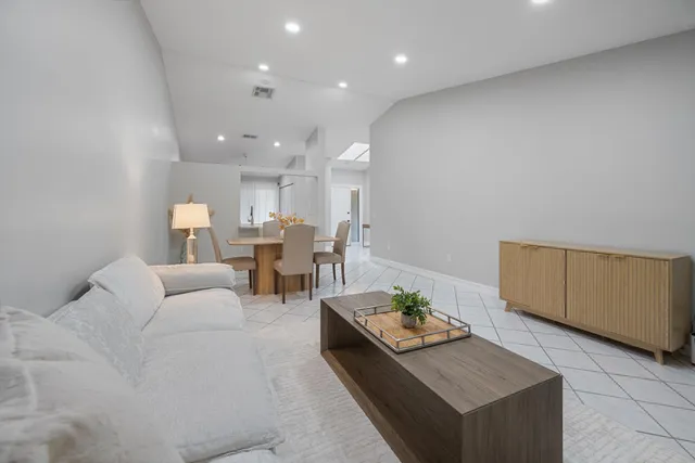 a view of kitchen with furniture and wooden floor
