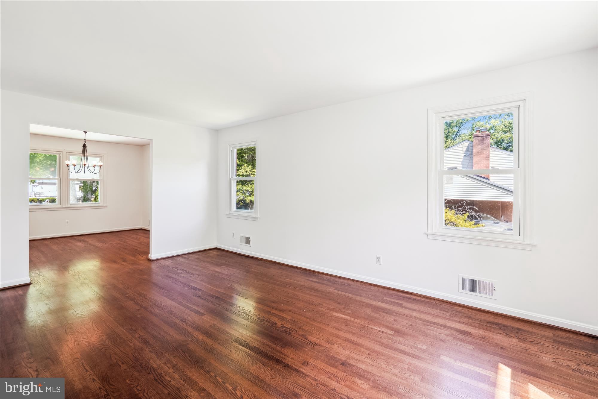 2445 Parallel Lane Silver Spring, MD 20904 - Photo 16 of 82 a view of an empty room with window and wooden floor