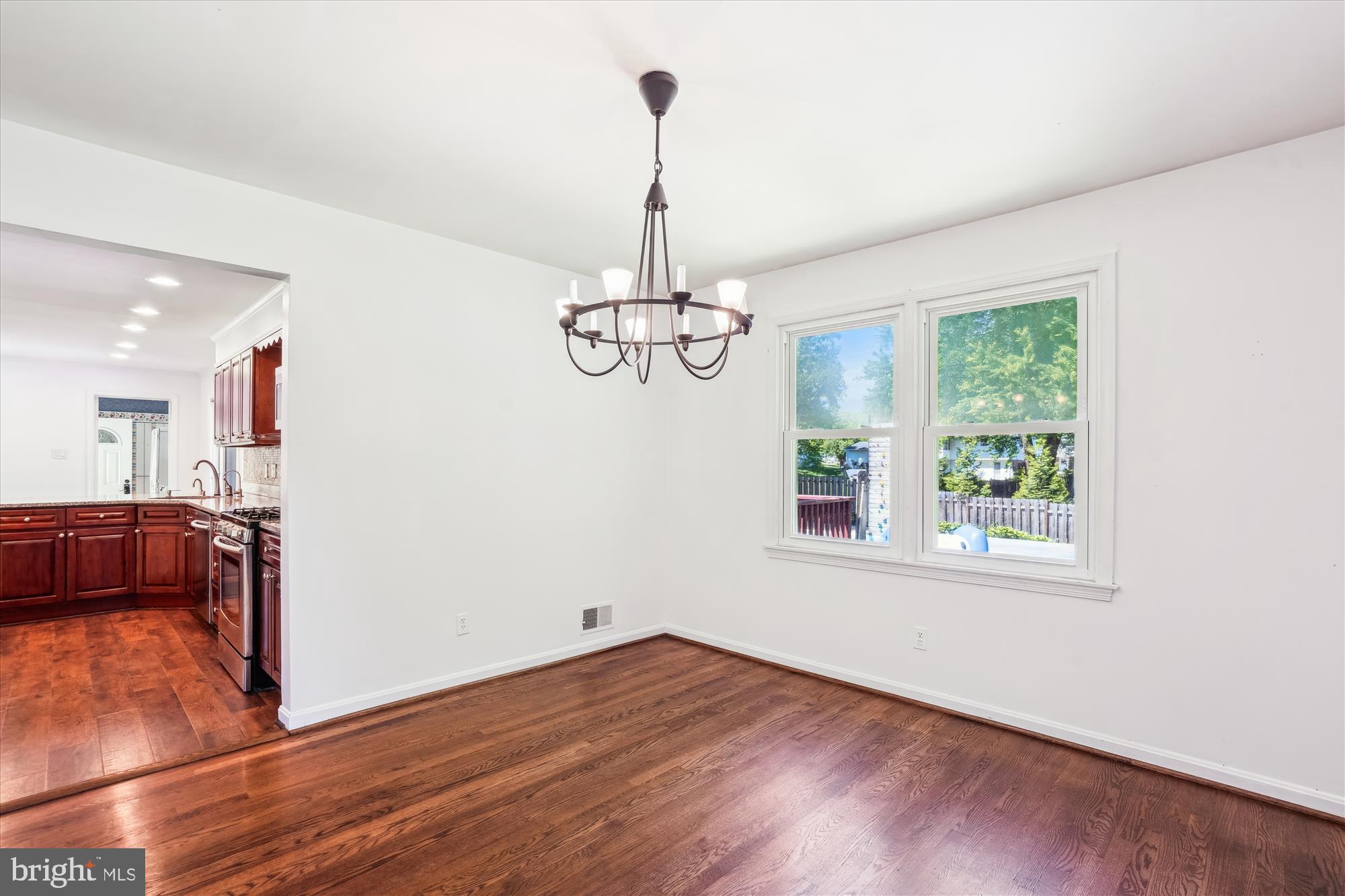 2445 Parallel Lane Silver Spring, MD 20904 - Photo 19 of 82 a view of a room with wooden floor chandelier and windows