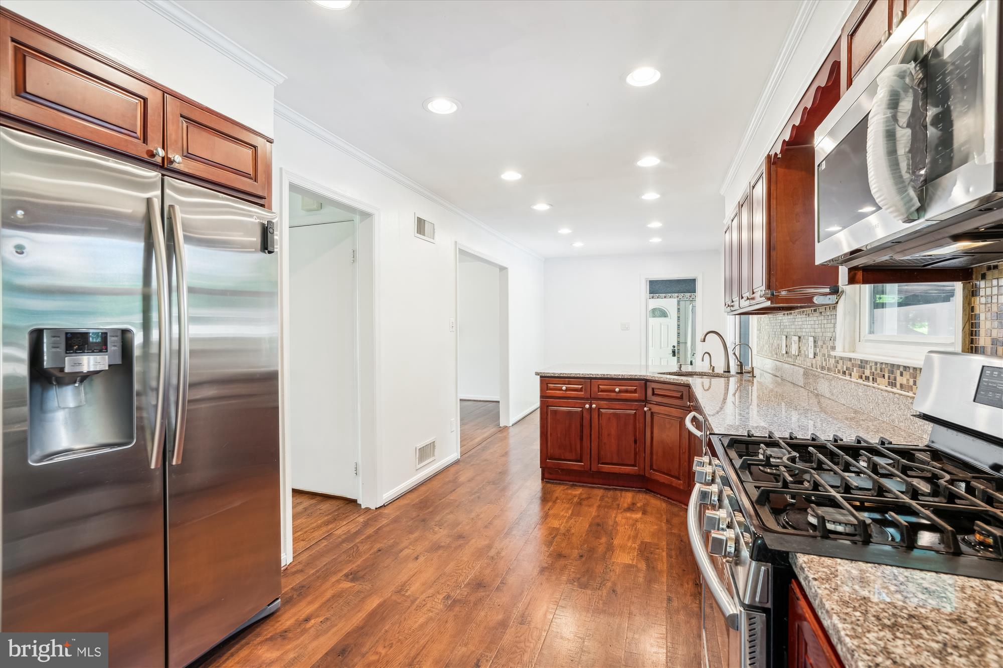 2445 Parallel Lane Silver Spring, MD 20904 - Photo 22 of 82 a kitchen with stainless steel appliances granite countertop a refrigerator and a stove top oven