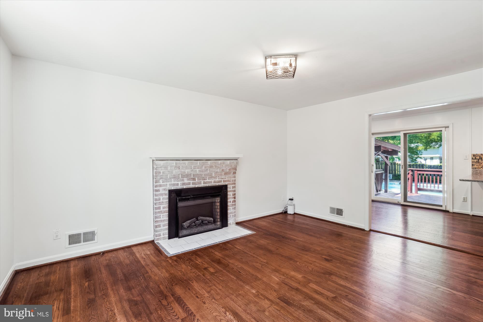 2445 Parallel Lane Silver Spring, MD 20904 - Photo 25 of 82 an empty room with windows and fireplace