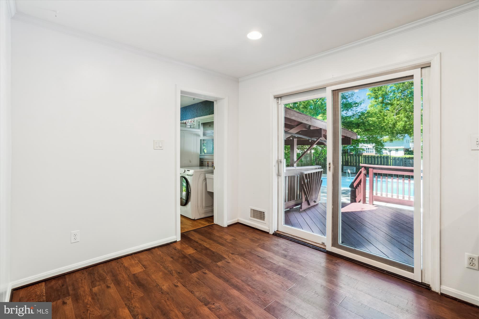 2445 Parallel Lane Silver Spring, MD 20904 - Photo 27 of 82 an empty room with wooden floor and windows