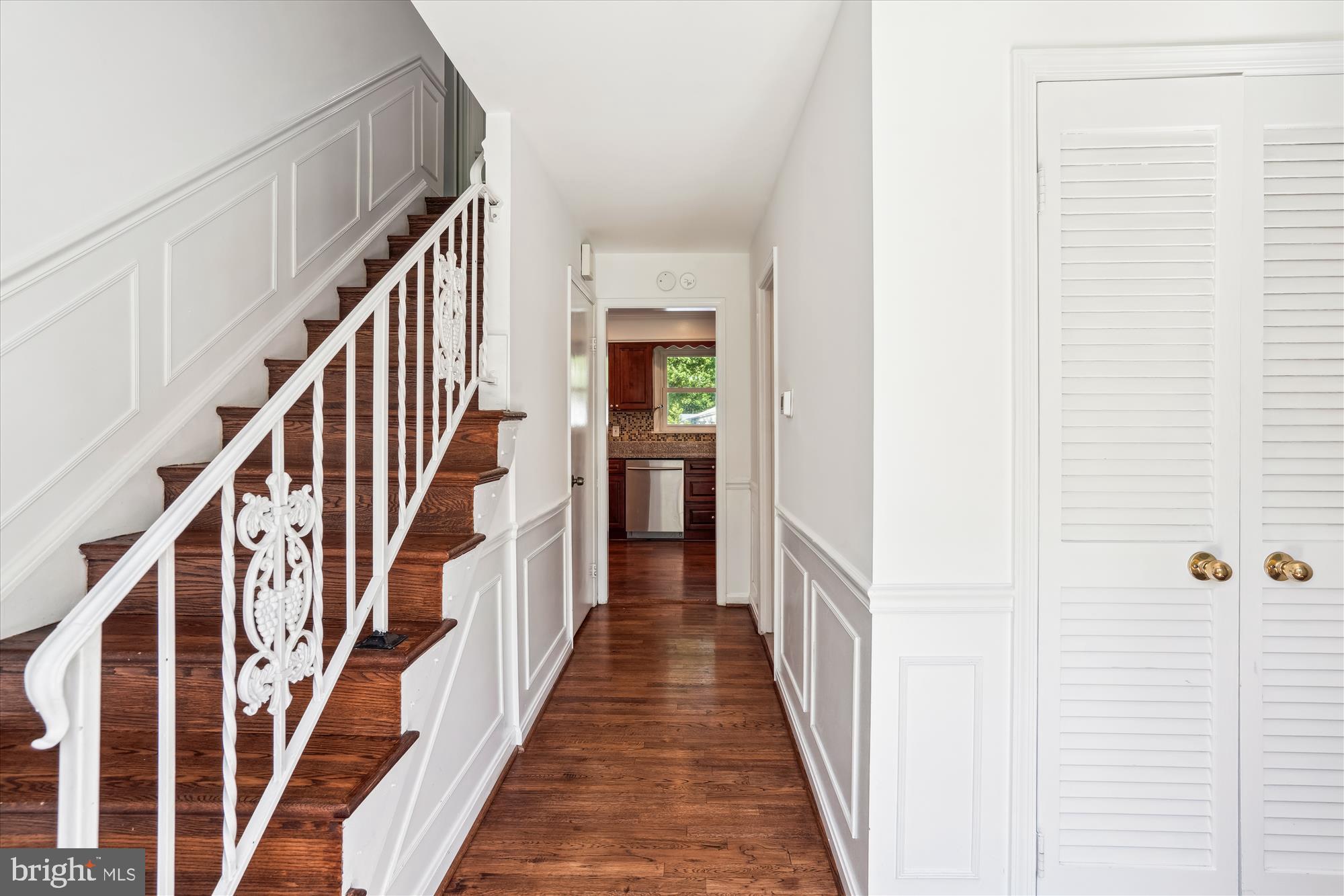 2445 Parallel Lane Silver Spring, MD 20904 - Photo 35 of 82 a view of a hallway with wooden floor and staircase