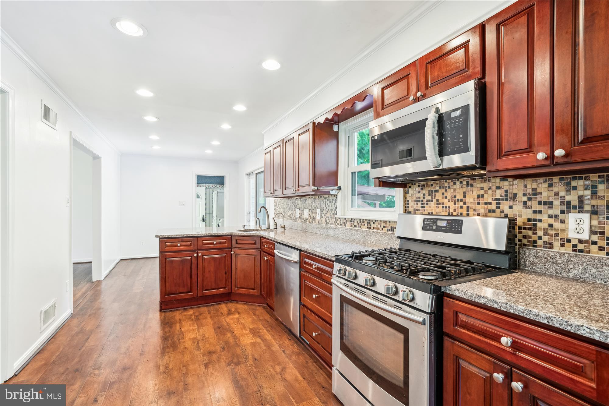 2445 Parallel Lane Silver Spring, MD 20904 - Photo 4 of 82 a kitchen with stainless steel appliances granite countertop a stove a sink and a microwave