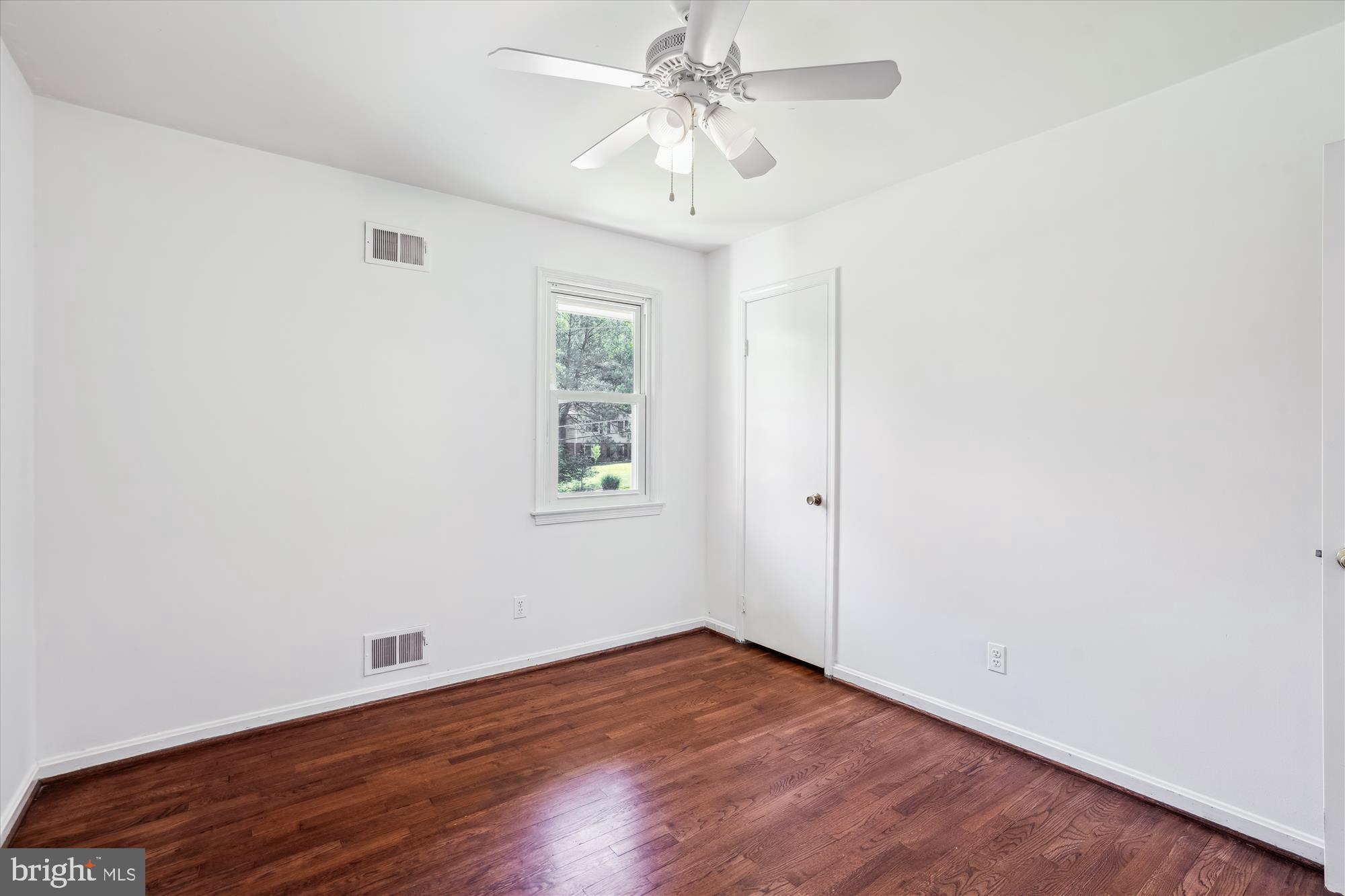 2445 Parallel Lane Silver Spring, MD 20904 - Photo 46 of 82 an empty room with a window and a fan