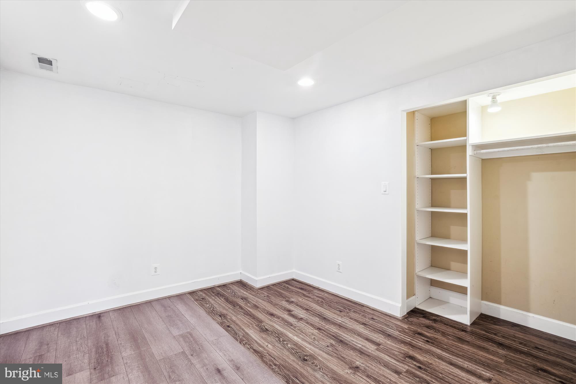 2445 Parallel Lane Silver Spring, MD 20904 - Photo 61 of 82 a view of an empty room with wooden floor and closet