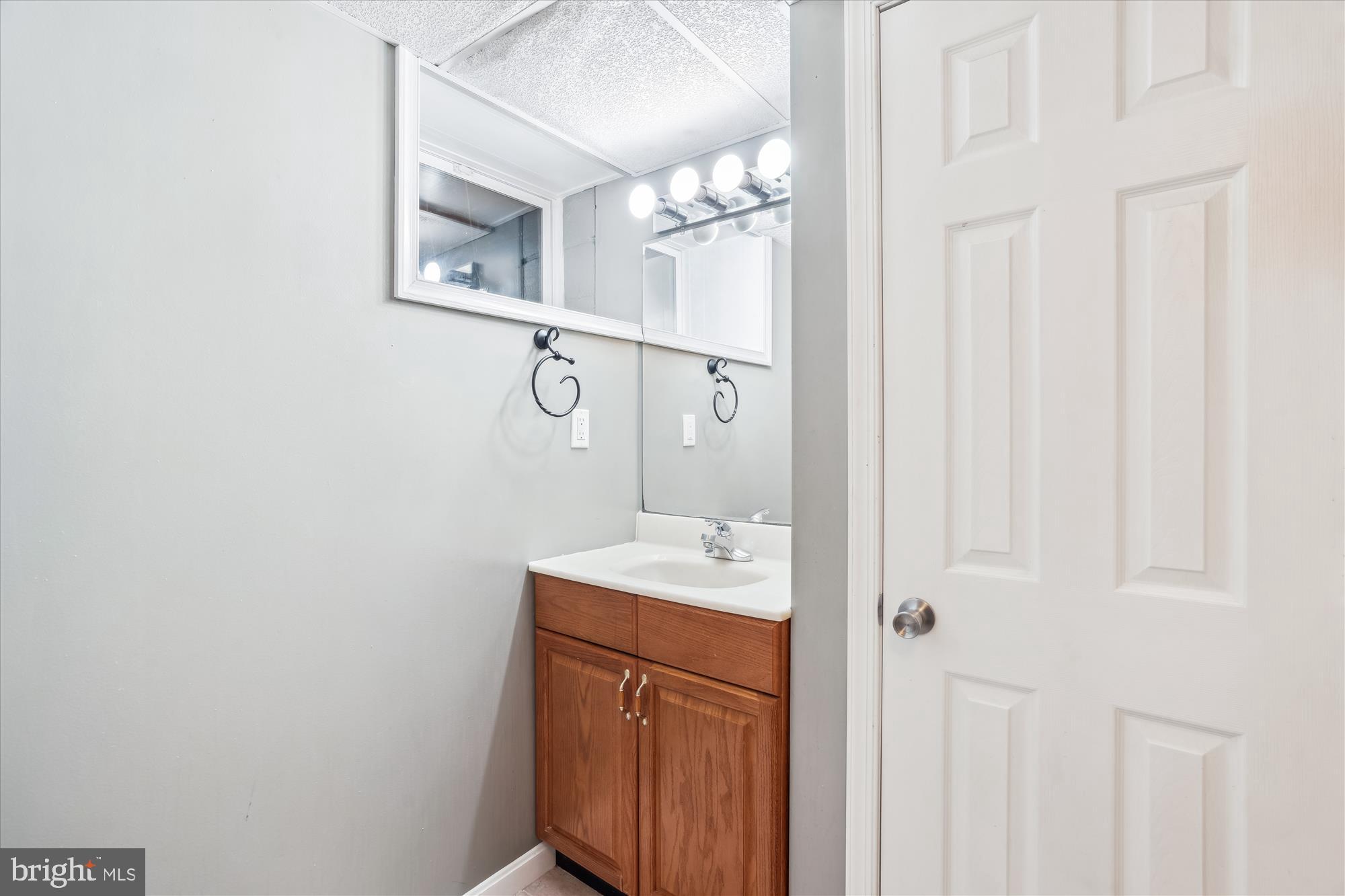 2445 Parallel Lane Silver Spring, MD 20904 - Photo 63 of 82 a bathroom with a sink a mirror and vanity