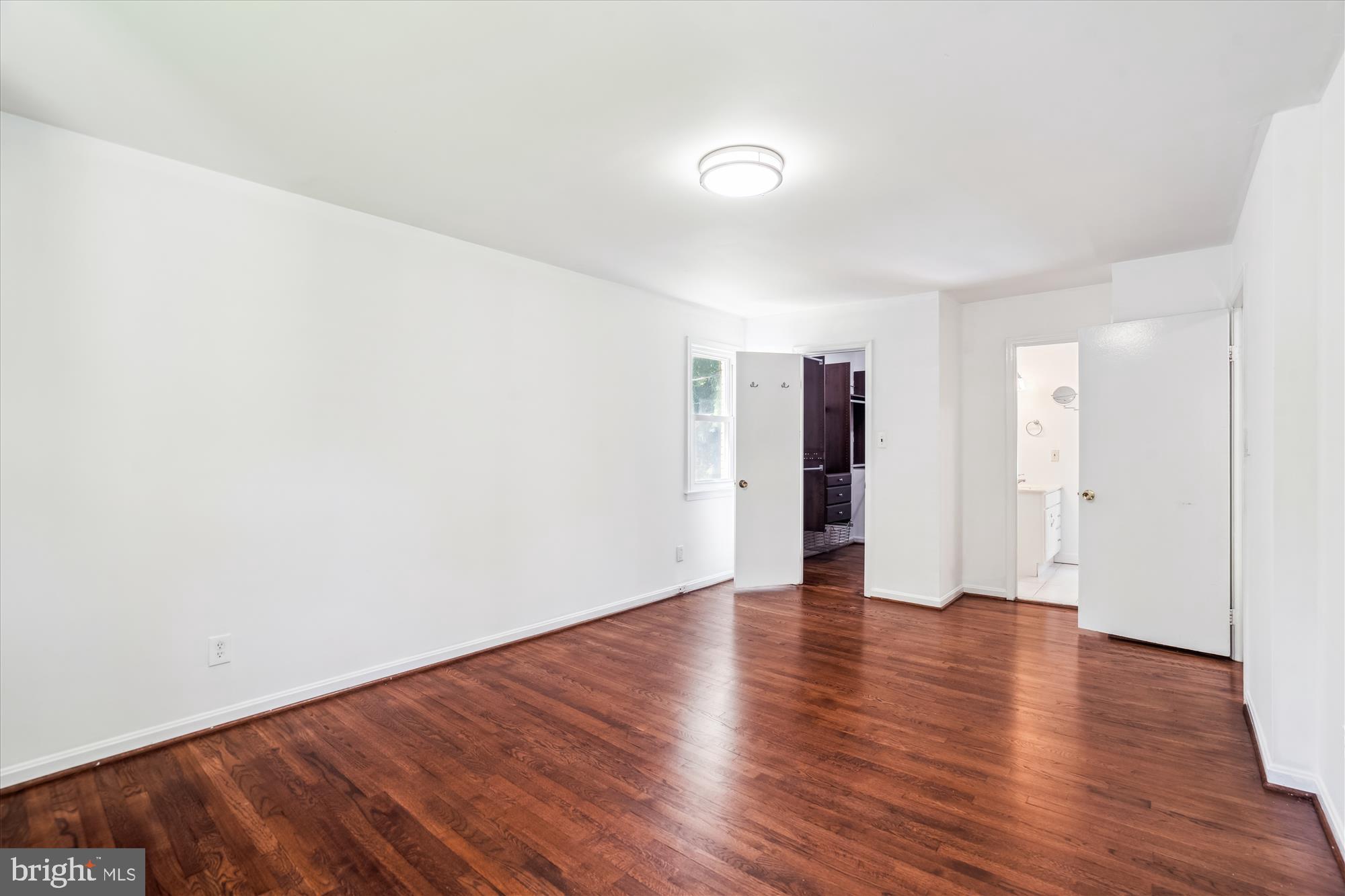 2445 Parallel Lane Silver Spring, MD 20904 - Photo 9 of 82 a view of an empty room with wooden floor and closet