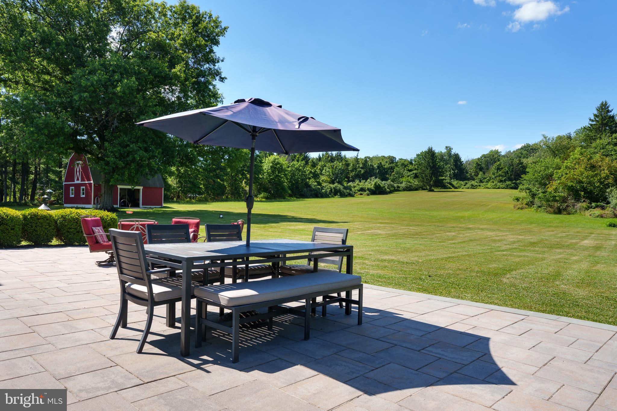 56 Valley Road Lambertville, NJ 08530 - Photo 44 of 49 an outdoor space with furniture and umbrella