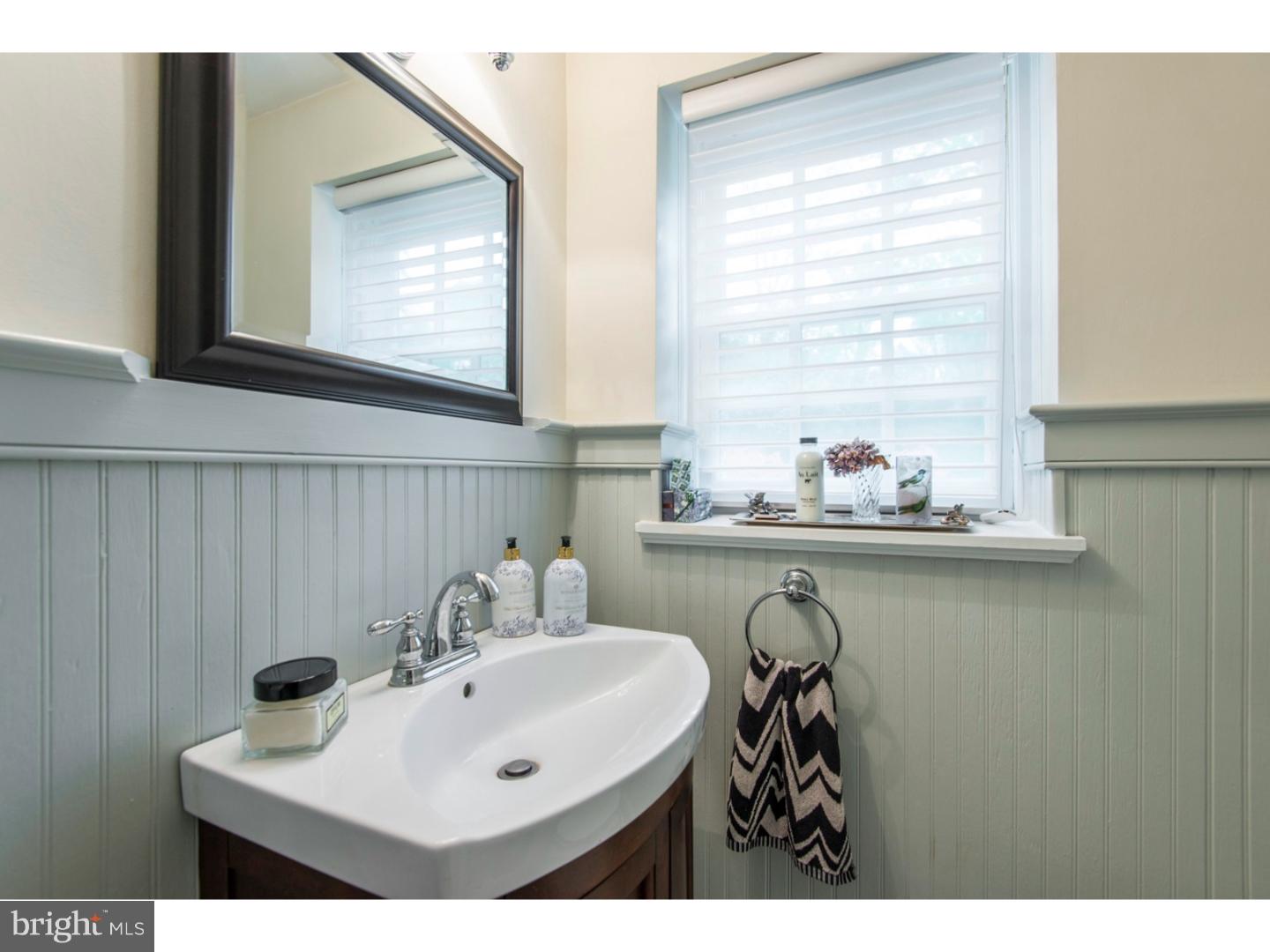 16 Wistar Road Villanova, PA 19085 - Photo 11 of 25 a bathroom with a sink and a mirror
