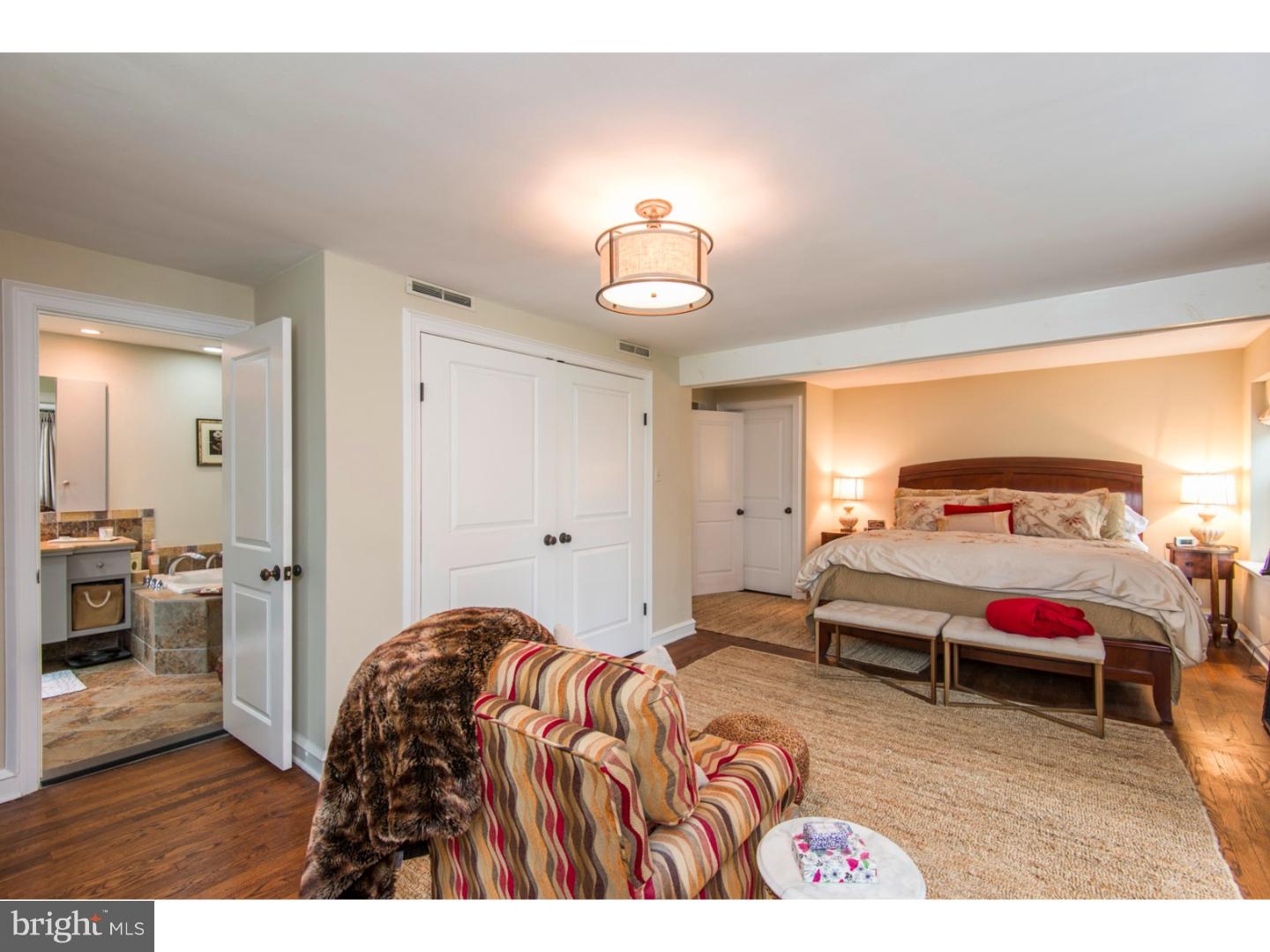 16 Wistar Road Villanova, PA 19085 - Photo 12 of 25 a bedroom with a bed and a view of living room