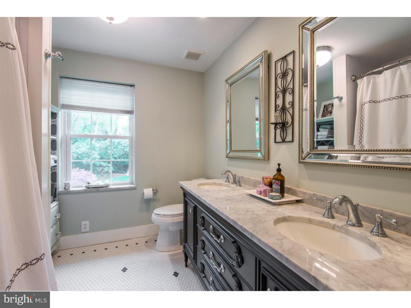16 Wistar Road Villanova, PA 19085 - Photo 18 of 25 a bathroom with a granite countertop double vanity sink a mirror and a toilet