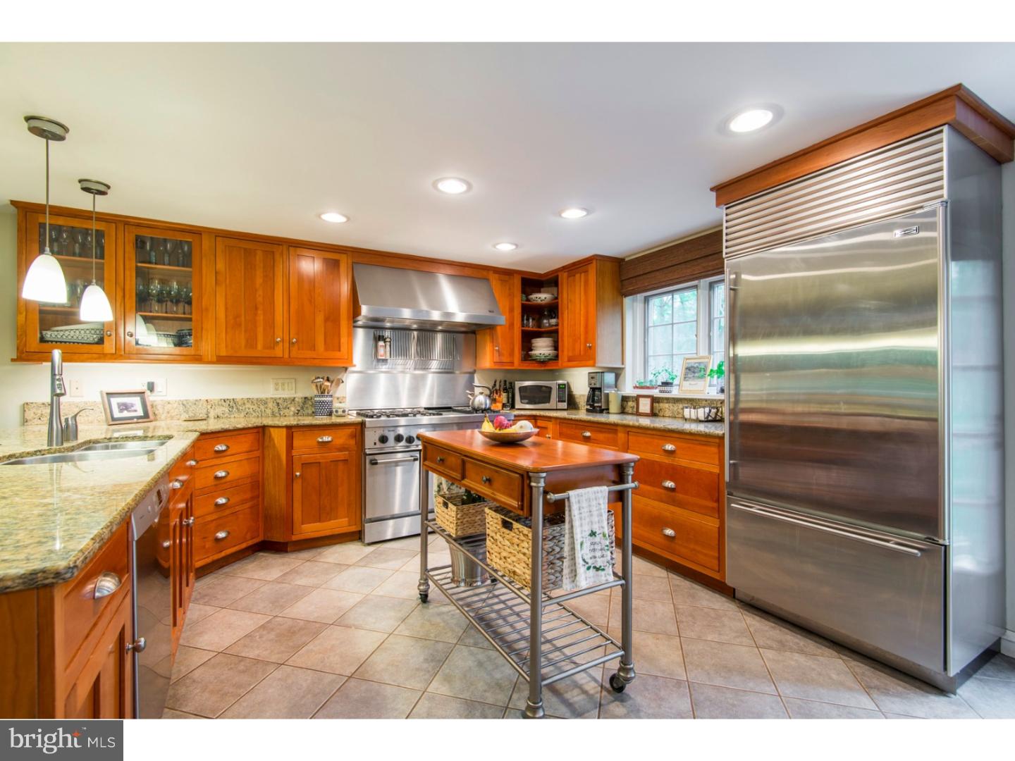 16 Wistar Road Villanova, PA 19085 - Photo 8 of 25 a kitchen with a refrigerator a sink and cabinets