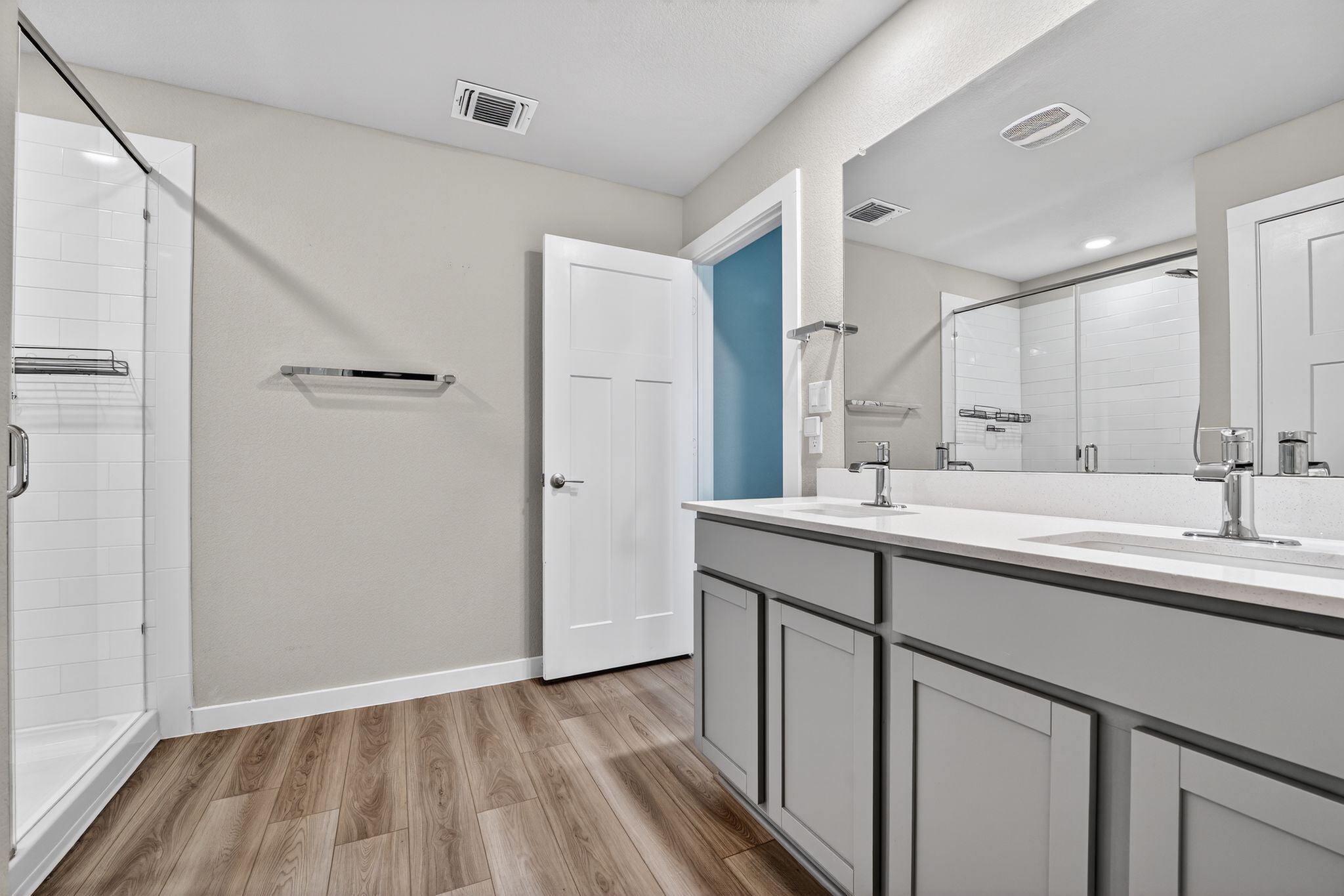 117 Halford Road Georgetown, TX 78633 - Photo 20 of 31 Full bathroom featuring double vanity, light wood-style floors, and a stall shower