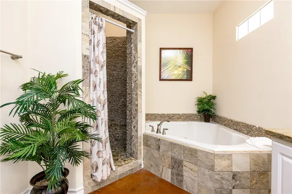 a bath tub sitting in a bathroom next to a tub