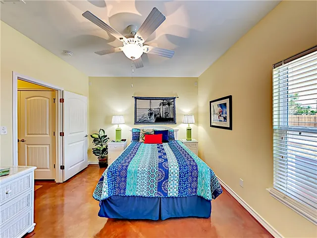 a room with wooden floor and windows