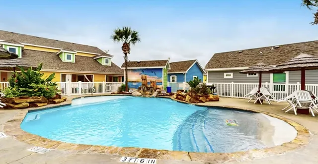 a view of a house with swimming pool