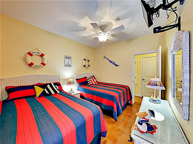 a bedroom with bed and a book shelf