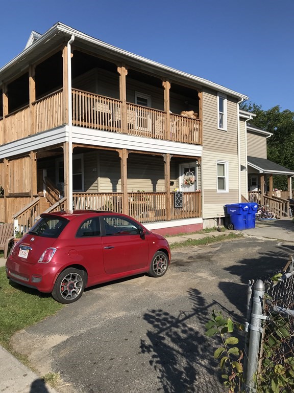 28 Florence Street Springfield, MA 01105 - Photo 3 of 4 a front view of a house with parking space