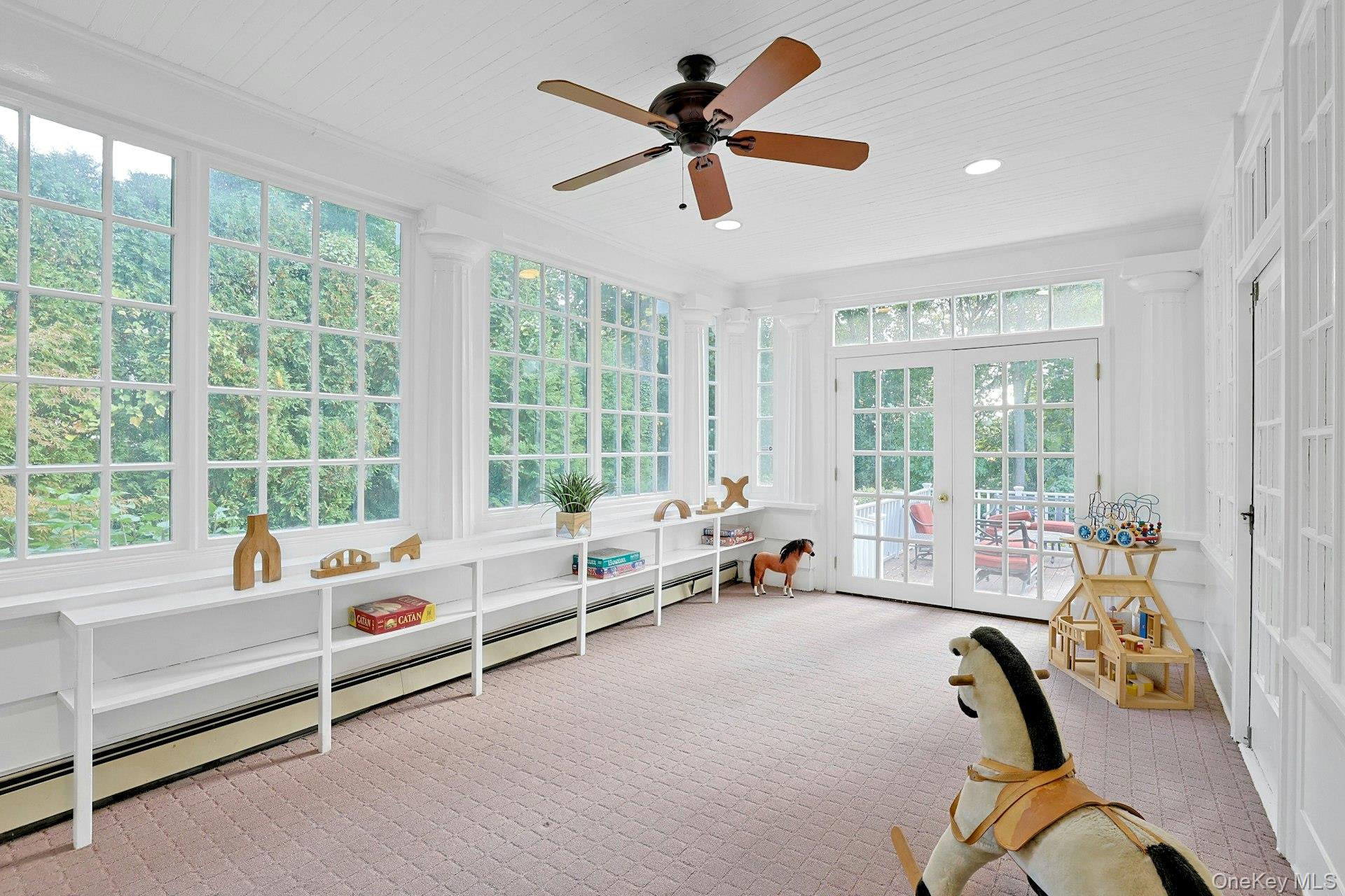 49 Overlook Circle New Rochelle, NY 10804 - Photo 17 of 47 a living room with furniture and windows