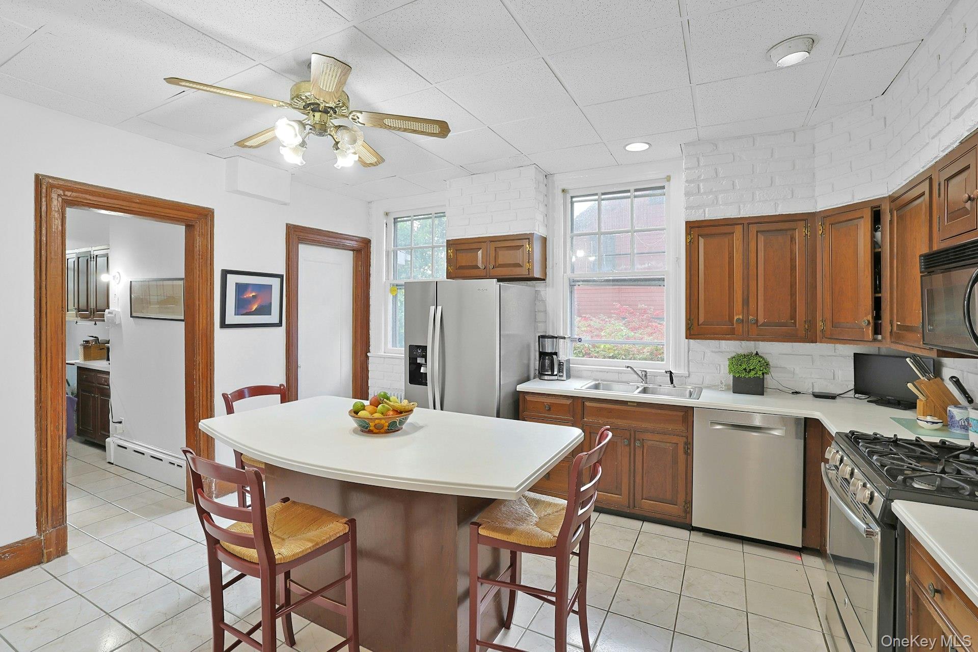 49 Overlook Circle New Rochelle, NY 10804 - Photo 19 of 47 a kitchen that has a table and chairs in it