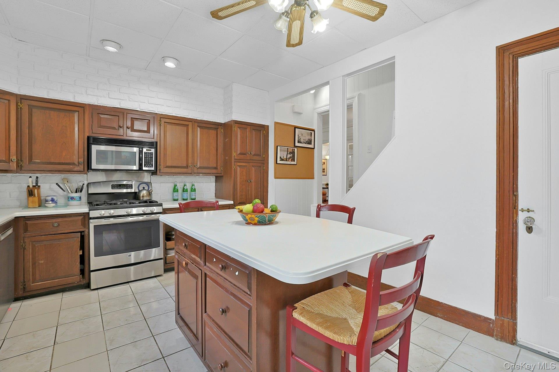 49 Overlook Circle New Rochelle, NY 10804 - Photo 20 of 47 a kitchen with a stove a sink and a refrigerator