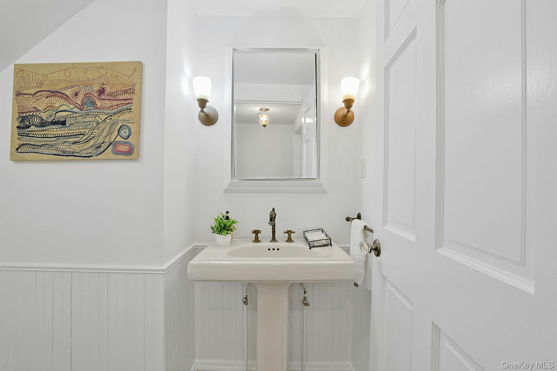 49 Overlook Circle New Rochelle, NY 10804 - Photo 24 of 47 a bathroom with a sink and mirror