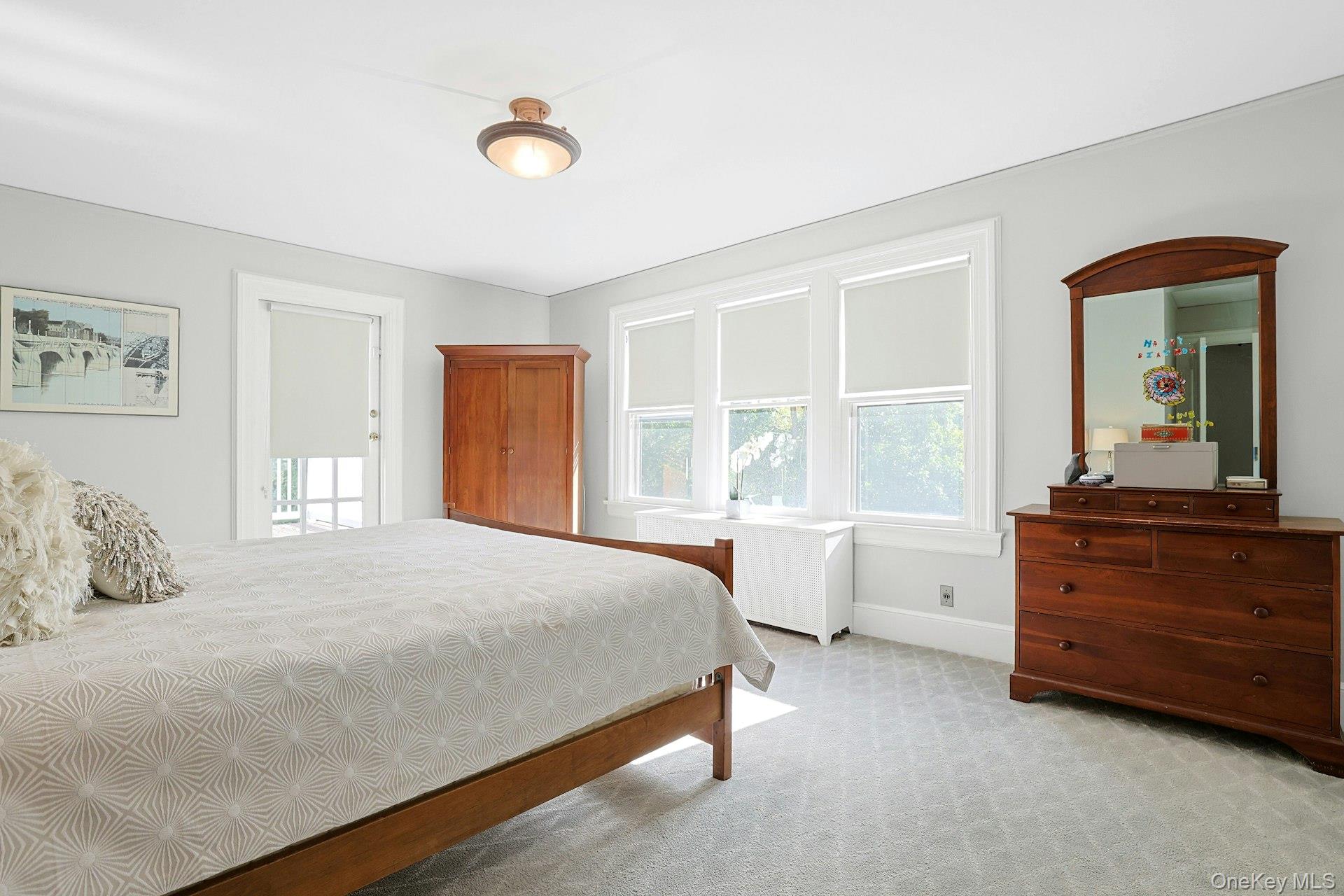 49 Overlook Circle New Rochelle, NY 10804 - Photo 27 of 47 a bedroom with a bed and a dresser