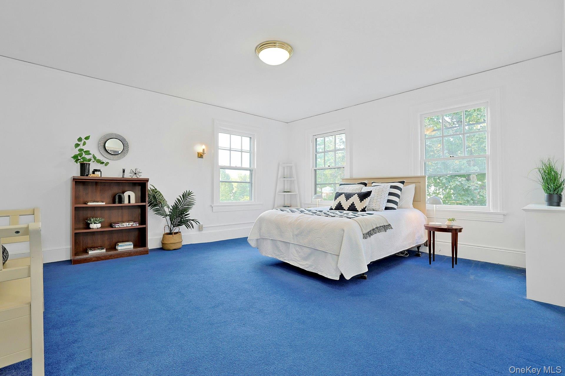 49 Overlook Circle New Rochelle, NY 10804 - Photo 32 of 47 a bedroom with a bed and a couch